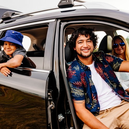 Relaxed looking family inside a car