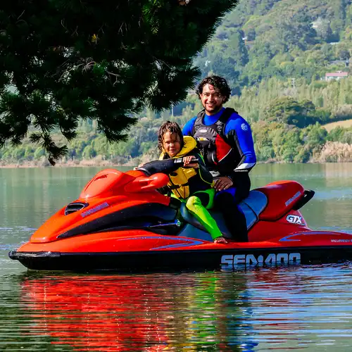 Man and son on a jet ski