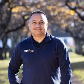 Man on path posing for a headshot