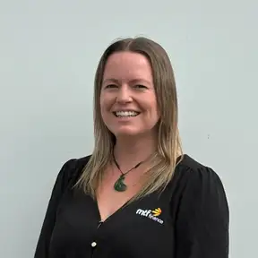 A photo of a woman looking directly at the camera