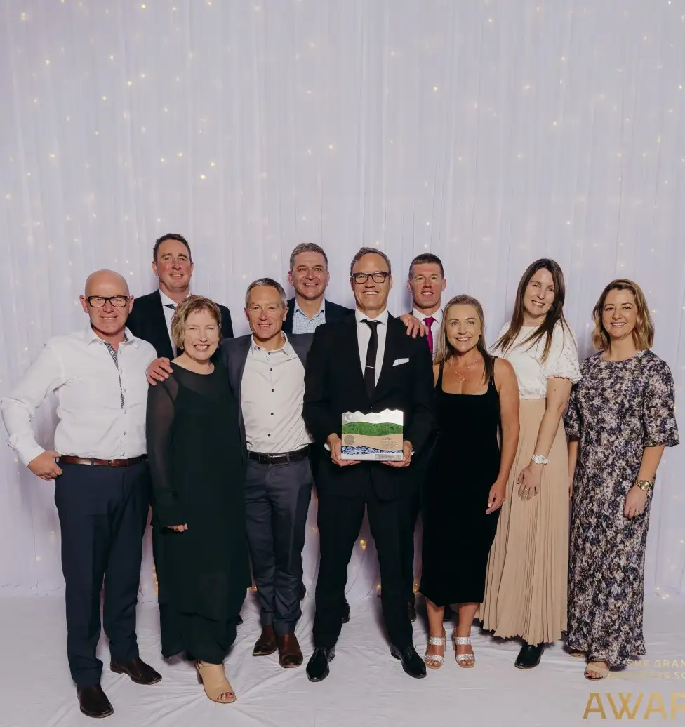 A group of staff from MTF Finance holding their award at The Grand Business South Awards 2023