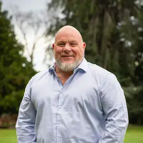 Man posing for headshot in park