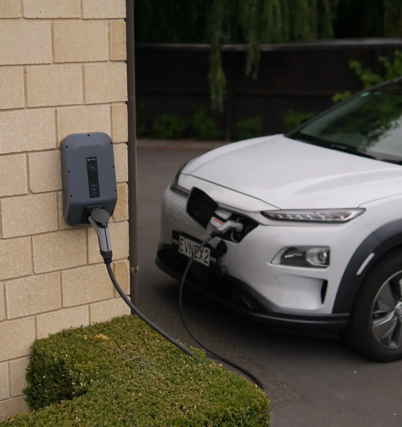 An electric vehicle charging at home