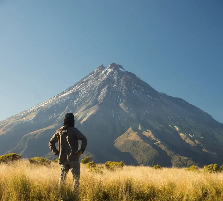 Man looking at Mt Taranaki