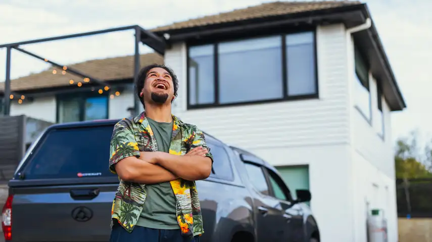 Man with car and House